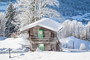 Traditional wooden mountain chalet in scenic wonderland scenery in the Alps