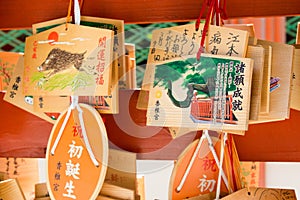 Traditional wooden prayer tablet Ema at Kashii-gu Shrine in Fukuoka, Japan. The Shrine was