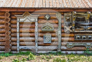 Traditional wooden Russian carved platband of an old wooden house