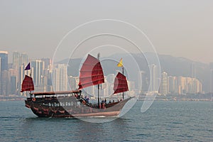 Traditional Wooden Sailboat sailing in Victoria Harbour in Hong