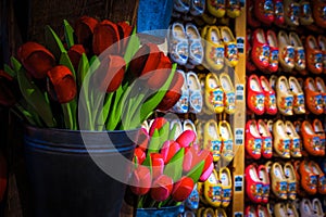 Traditional wooden shoes and wooden tulips in souvenir shop, Netherlands