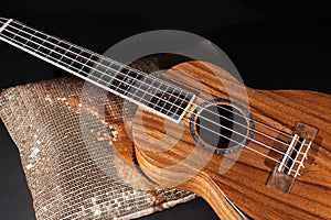 Traditional wooden ukulele in close up. Hawaiian uke on display. photo