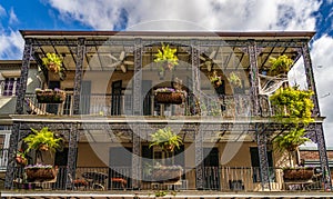 Traditional wrought iron balcony on brick New Orleans house