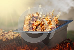 Traditional yakitori chicken stand in Japan at street food vendor market, grilled satay. Japanese Food