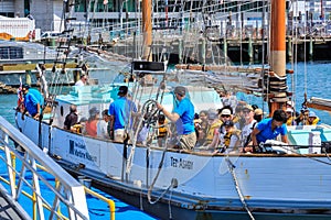 Passengers on a traditional wooden sailing ship, Auckland, New Zealand