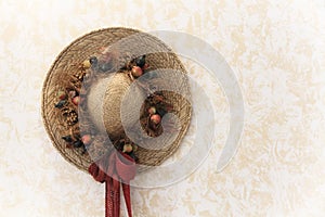 Traditionally decorated vintage handmade lady straw hat with floral bouquet