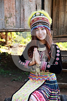 Traditionally dressed Mhong hill tribe woman pay respect