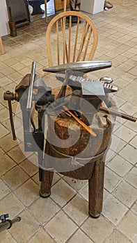 Traditionally fine art ilversmith tools on a wooden workbench