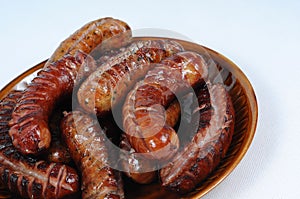 Traditionally grilled sausages on a plate