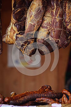 Traditionally homemade cured meat, smoked, hanged in the market