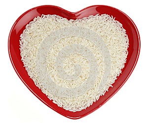 Traditionally Indian basmati Rice in red heart photo