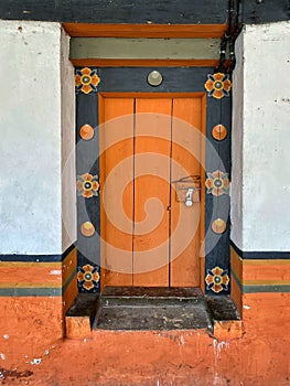 Traditionally painted wooden door in Bhutan