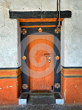 Traditionally painted wooden door in Bhutan