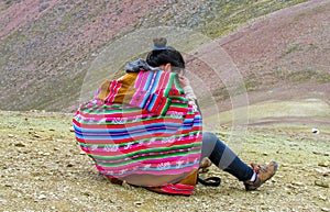 Traditionaly dressed peruvian quechua women in the mountains