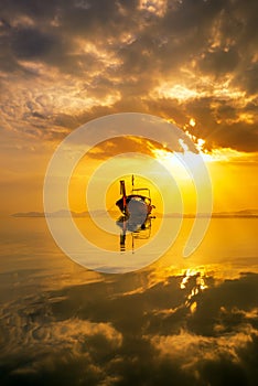 Traditionnal Thai long tail boat at sunset