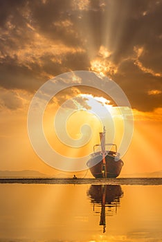 Traditionnal Thai long tail boat at sunset