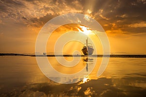 Traditionnal Thai long tail boat at sunset