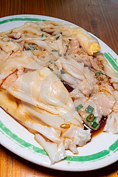 traditonal Cantonese food of cheong fun or rice noodle rolls or steamed vermicelli rolls vertical composition