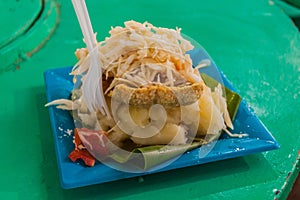 Traditonal food in Granada, Nicaragua. It`s called vigoron - yucca with fried pork skin and sla
