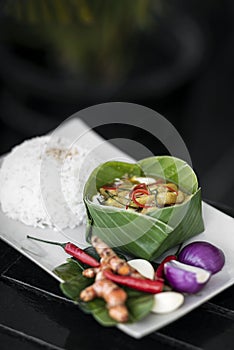 Tradtional cambodian amok fish curry meal on restaurant table