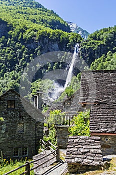 The tradtional stone houses with church tower in the beautiful village of Foroglio photo