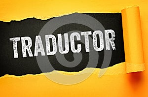 TRADUCTOR word presented on torn paper with distressed letters. Concept for Spanish translation, language support, dictionary,