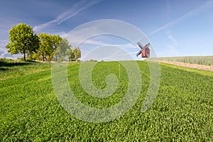 Traebene Mill Windmill with green fields