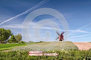 Traebene Mill Windmill with green fields