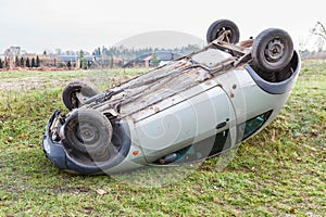 Traffic accident, car after rollover lie on the roof