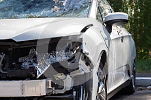 Traffic accident on the street, damaged car after a collision in the city. Accident due to speeding and alcohol intoxication.