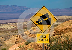Traffic alerts downhill slope, mojave desert USA