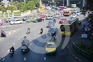 Traffic along a busy road at Victory Monument in Bangkok, Thailand : BANGKOK - January 17, 2019