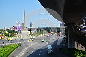 Traffic along a busy road at Victory Monument in Bangkok, Thailand : BANGKOK - January 17, 2019