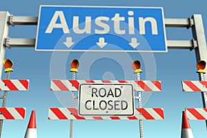 Traffic barricades at Austin city traffic sign. Coronavirus disease quarantine or lockdown in the United States