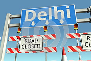 Traffic barricades near Delhi city traffic sign. Coronavirus disease quarantine or lockdown in India conceptual 3D