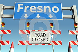 Traffic barricades near Fresno city traffic sign. Lockdown in the United States conceptual 3D rendering