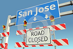 Traffic barricades at San Jose city traffic sign. Coronavirus disease quarantine or lockdown in the United States