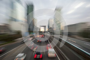 Traffic with blur light through city on urban highway at dusk. B