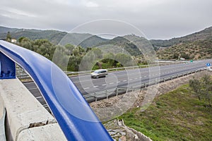 Traffic from bridge at spanish national road with slow vehicles photo