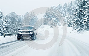 Traffic car on winter road in snow blizzard