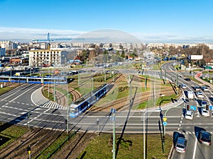 Traffic circle with tramways, trams and cars in Krakow, Poland. Aerial view