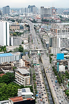 Traffic on city streets at evening, Bangkok road with car beautiful landmark in business downtown in Thailand.