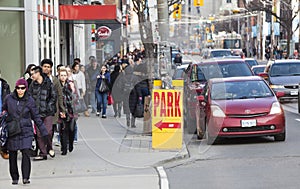 Traffic in the city of Toronto and citizens, Canada. Park sign