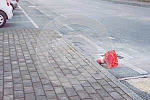 traffic cone near the pedestrian crossing is abandoned