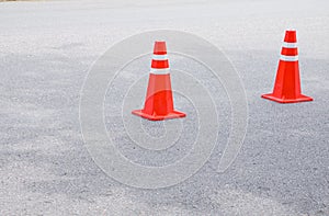 Traffic cone row old orange and swath white stripes on the road with copy space