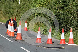 Traffic cones around subsidence at road works