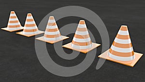 Traffic cones arranged in a row on the asphalt