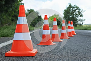 Traffic cones on asphalt highway. Road repair