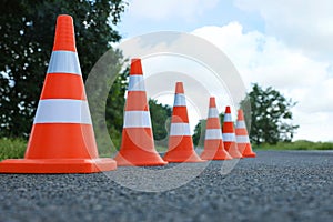 Traffic cones on asphalt highway. Road repair