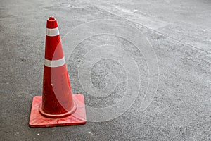 Traffic cones on dark asphalt, copy space